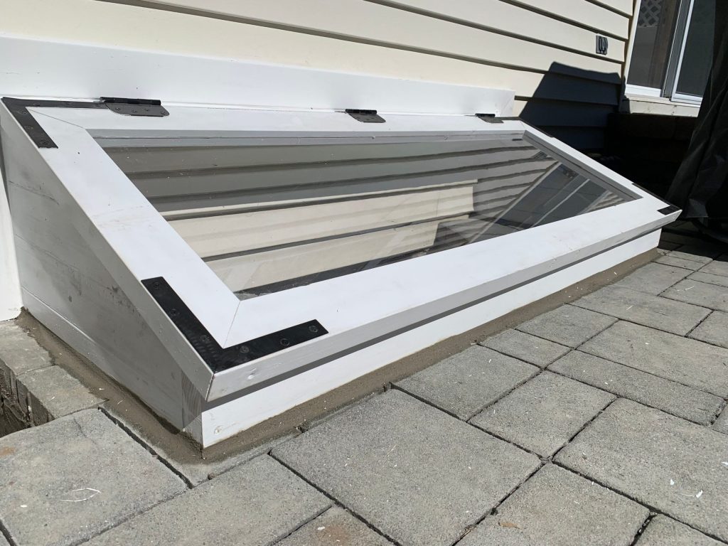Custom glass egress well cover