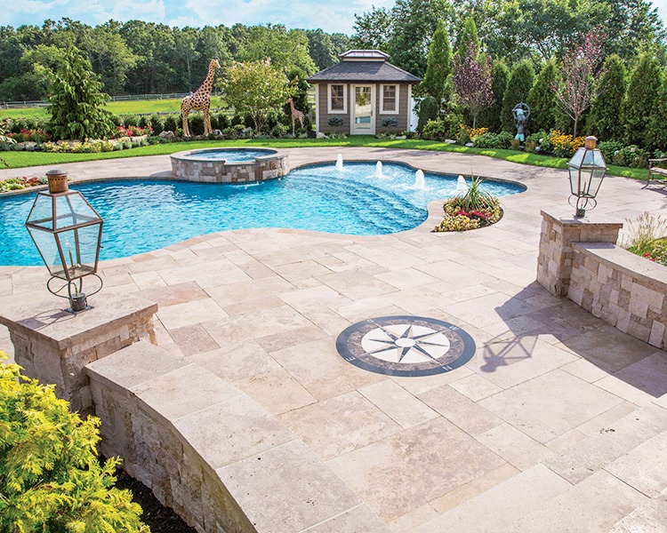 pool and paved backyard with emblem